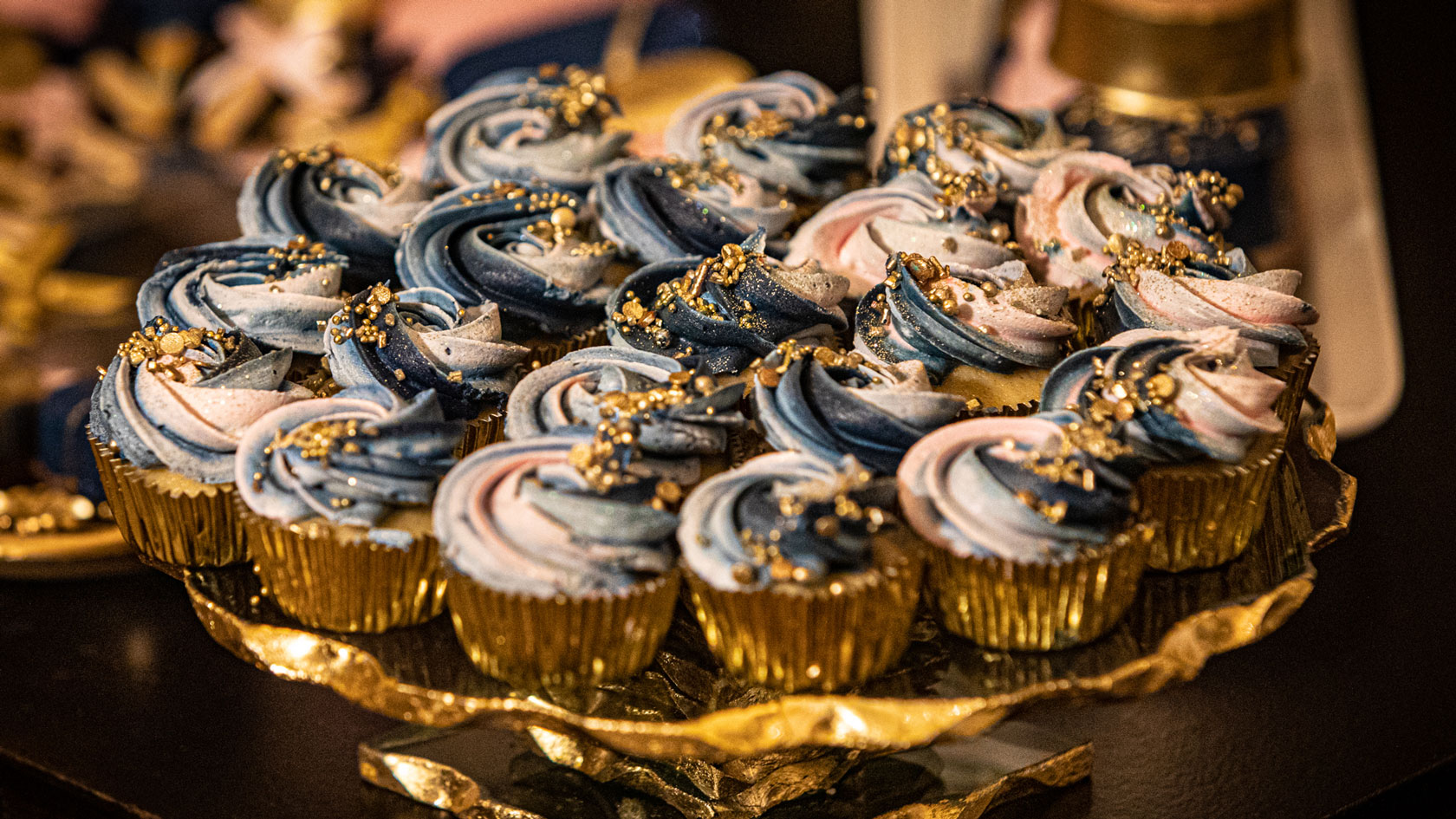 miniature cupcakes on an ornate gold plate