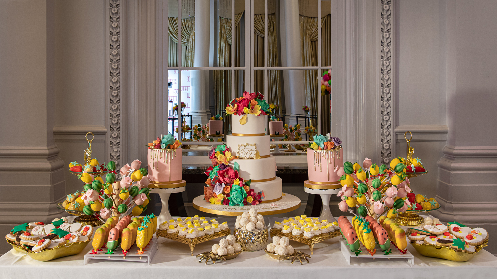 A colourful carnival inspired Indulgence Bar® dessert table at The Langham hotel in London